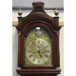 An 18th century oak longcase clock with eight day movement striking on a bell, the 12-inch brass