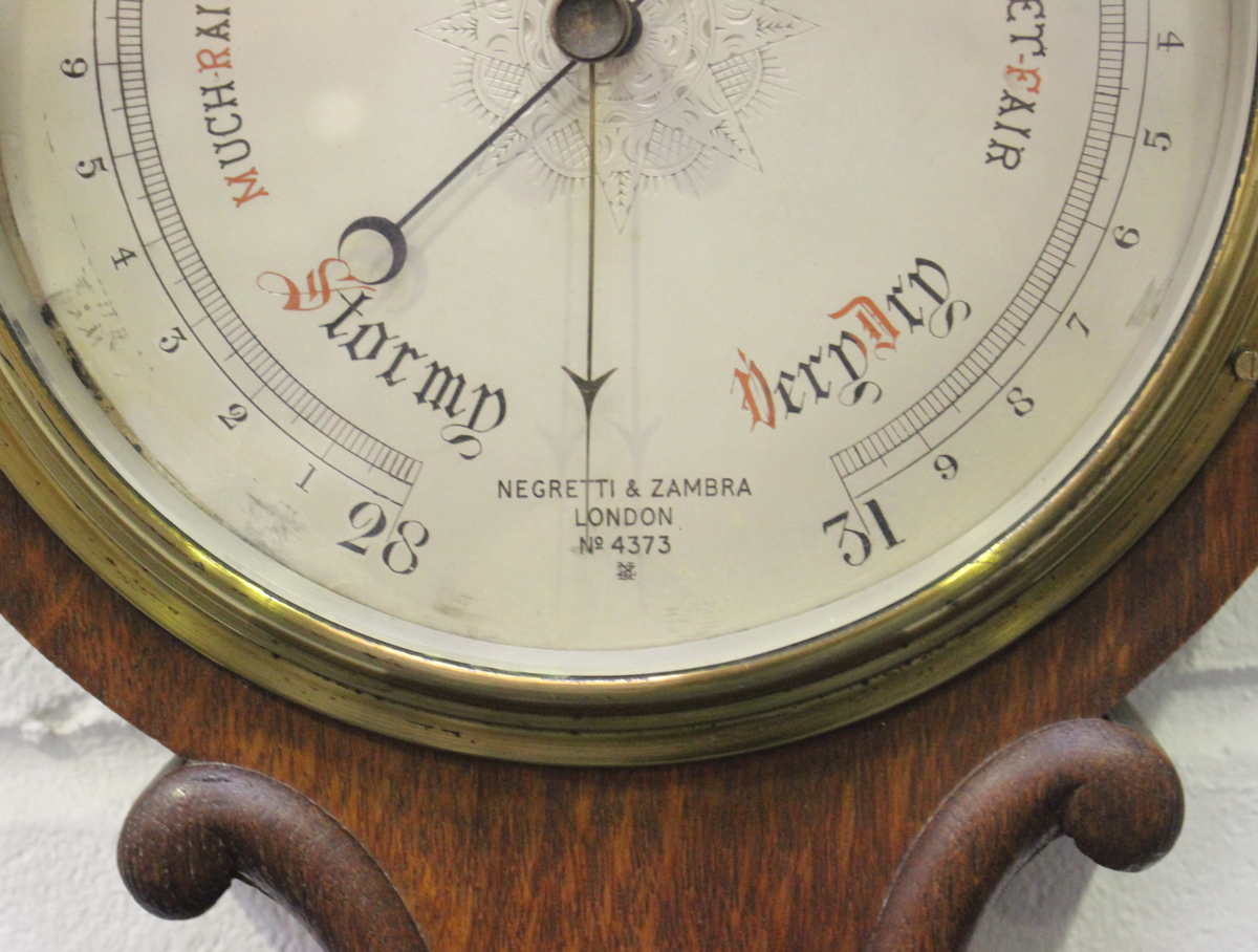 Two late Victorian wheel barometers, each with mercury thermometer, silvered dial and signed ' - Image 2 of 2