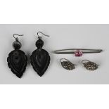 A pair of Victorian carved jet pendant earrings, each of drop shaped form, with wire fittings,