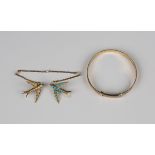 A pair of gold, turquoise and seed pearl brooches, circa 1900, designed as two swallows, connected