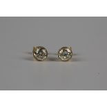 A pair of 18ct gold diamond single stone earstuds, each collet set with a circular cut diamond, with