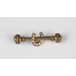 A Victorian gold and seed pearl bar brooch with a horseshoe motif, detailed '15ct', weight 4.8g,