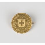 A Switzerland twenty francs 1891, mounted as a brooch.Buyer’s Premium 29.4% (including VAT @ 20%) of