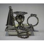 A George IV silver chamberstick and snuffer with urn shaped sconce and detachable nozzle with