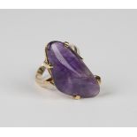 A gold ring, claw set with a tumbled amethyst, detailed 'C18', weight 9.9g, ring size approx U.