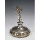 A silver trophy cup cover, the finial in the form of a golfer swinging a club, no date or maker's