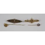 A late Victorian 9ct gold and diamond bar brooch with applied ropetwist and foliate decoration,