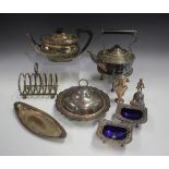 A group of plated items, including a cushion shaped teapot, a kettle-on-stand, a muffin dish,