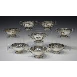 A set of eight Chilean Hecho Amano .900 silver circular sundae bowls, each with twin scroll handles,