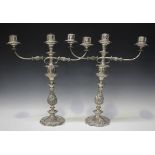 A pair of mid-19th century Sheffield plate three-light twin scroll branch candelabra, each with