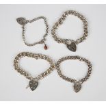 Four silver curblink bracelets, each with a silver heart shaped padlock clasp, total weight 115.4g.