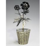 A Tiffany Mexico sterling model of a flower stem in a woven effect basket, designed by Janna Thomas,