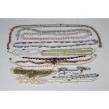 A single row necklace of graduated cultured pearls, four lengths of cultured pearls (require re-