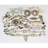 A collection of jewellery, including a marcasite and enamelled brooch, designed as a girl with a