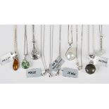 Three silver and diamond single stone pendants, each length 1.2cm, with silver neckchains, each