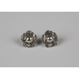 A pair of Georg Jensen silver earclips, circa 2002, each designed as a flowerhead, detailed 'Georg