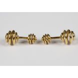 A pair of gold cufflinks, designed as coiled springs, detailed 'Schlumberger, Tiffany, 18K',