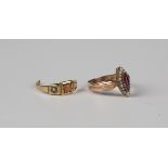 A Victorian gold, garnet and seed pearl marquise shaped cluster ring with decorated shoulders,