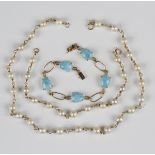 A gold and cultured pearl necklace, length 35cm, with a matching bracelet, length 18.5cm, each