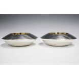 A pair of Elizabeth II silver circular salts, each of disc form with central gilt wells, London 1997