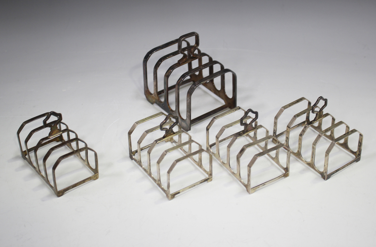 A set of three Elizabeth II silver four-division toast racks, London 1992, length 7.5cm, another