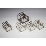 A set of three Elizabeth II silver four-division toast racks, London 1992, length 7.5cm, another