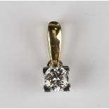 An 18ct gold pendant, claw set with a circular cut diamond, weight 0.7g, length 1.1cm, with a