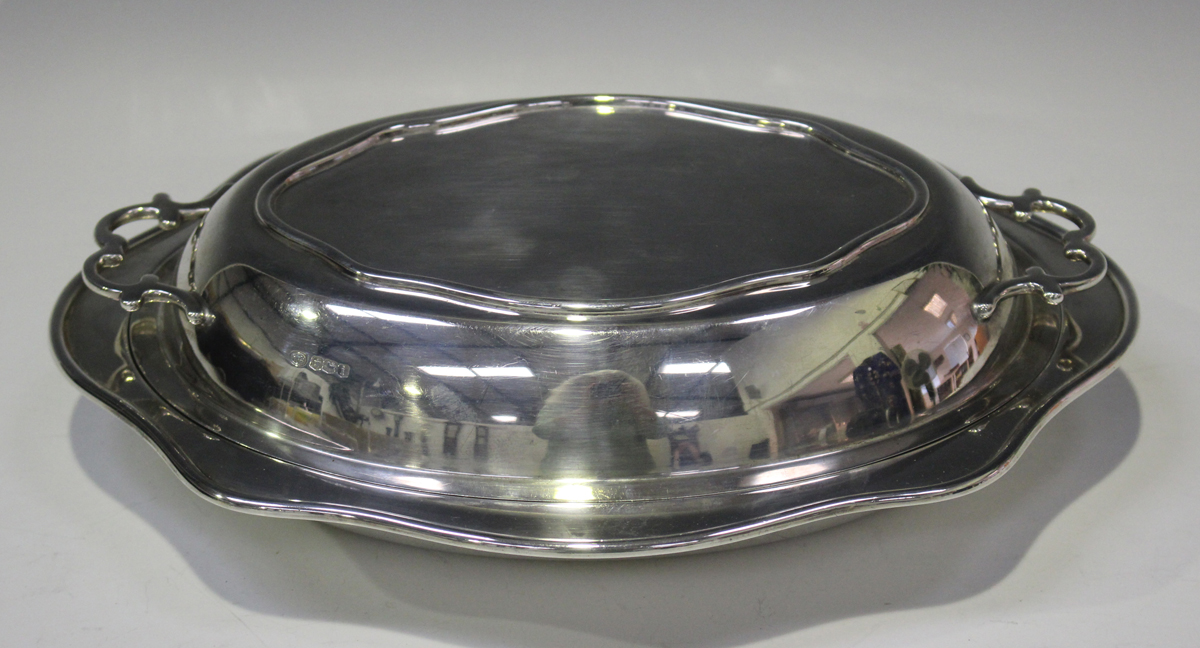 A George V silver oval entrée dish and two-handled cover with wavy rim, Sheffield 1926 by