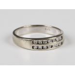 A 9ct white gold ring, mounted with two rows of seven circular cut diamonds, weight 3g, ring size