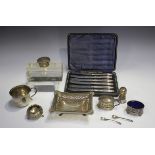 A George V silver shaped rectangular dish with pierced sides and cast scallop shell cornered