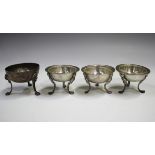 A set of three early 19th century Continental silver circular salts, each on figural shouldered