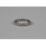 A diamond full eternity ring, mounted with circular cut diamonds, ring size approx J1/2, unmarked.