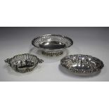 A George V silver oval footed bonbon dish with pierced sides, raised on a pierced oval foot, Chester