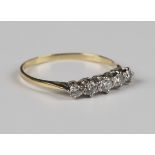 A gold and diamond five stone ring, mounted with a row of graduated circular cut diamonds,