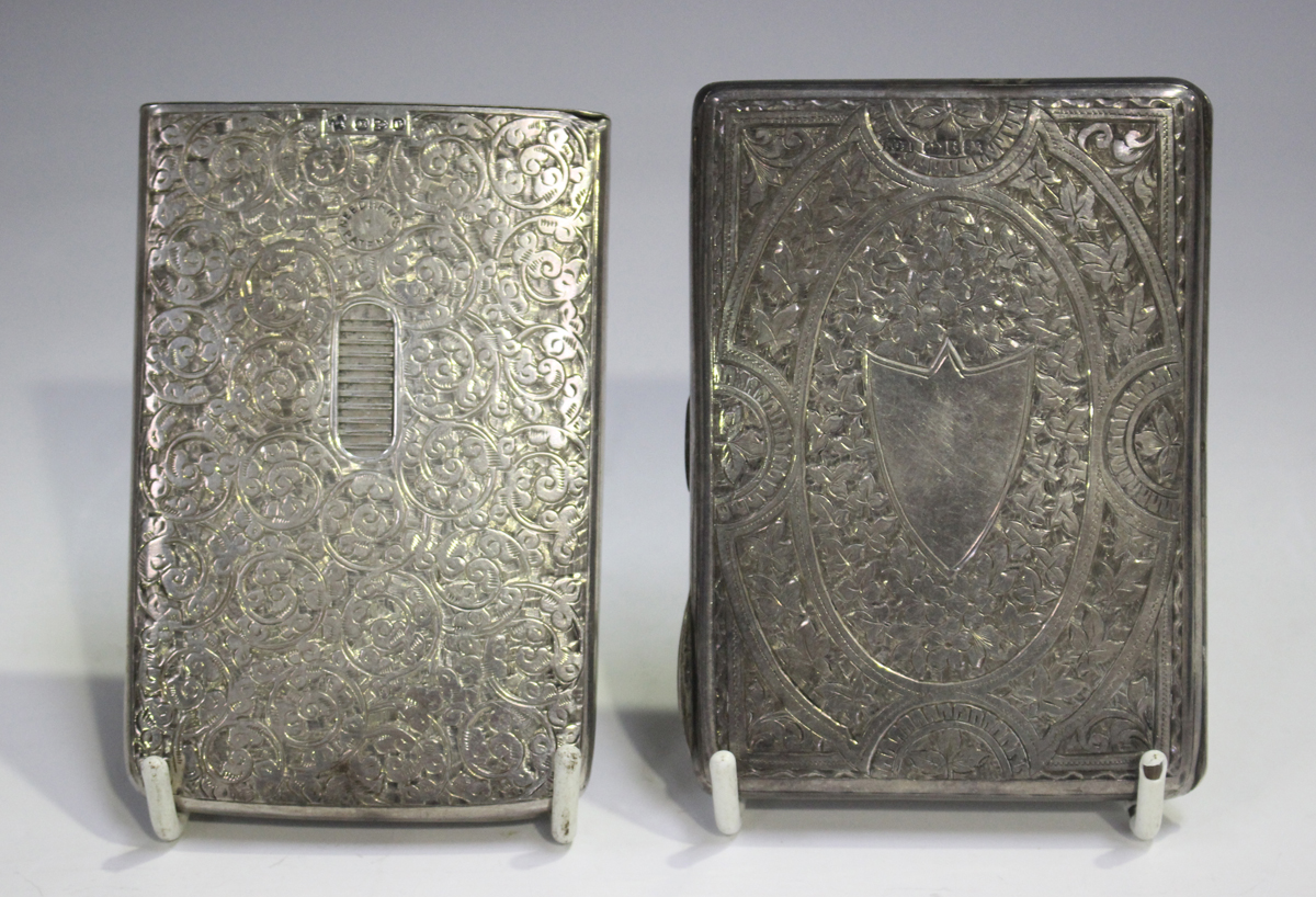 A late Victorian Needham's patent silver card case of rectangular form, engraved with foliate