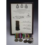 A 1939-45 Defence Medal and a War Medal, mounted on a bar, two fibre identity tags, six foreign