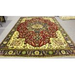 A Heriz carpet, North-west Persia, mid-20th century, the claret field with a flowerhead medallion,