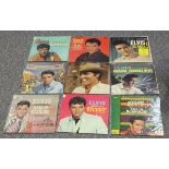 A collection of LP records and singles, including albums by Elvis Presley and The Beatles.Buyer’s