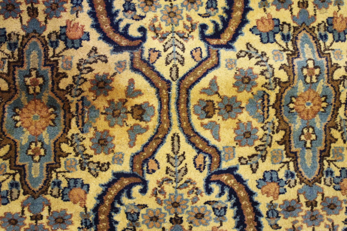 An Indian carpet, mid/late 20th century, the ivory field with an overall floral lattice, within a - Image 4 of 5