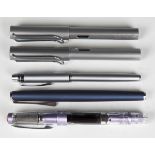 Three Lamy fountain pens, a Twsbi Diamond 580 AL R fountain pen and a Cross fountain pen, together