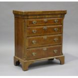 A 20th century George I style walnut bachelor's chest, fitted with a fold-over top and four