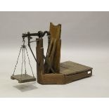 A set of early 20th century primitive pine balance scales, height 60cm, width 81cm.Buyer’s Premium