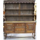 A Victorian oak dresser, the shelf back above two drawers flanked by cupboards, height 206cm,