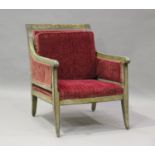 A 19th century Swedish green painted scroll armchair with foliate decoration, upholstered in red