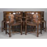 A set of six Arts and Crafts oak framed dining chairs, the design attributed to George Walton and