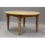 An early 20th century pine circular kitchen table, on turned legs, height 75cm, diameter 137cm.