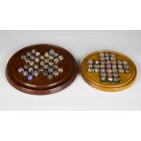 A collection of sixty-four Victorian and later glass marbles, diameters ranging from 14mm to 21mm,