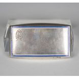 A .900 silver and enamelled curved rectangular cigarette case, the hinged lid with borders of blue