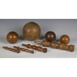 A large 19th century turned fruitwood bilboquet (cup-and-ball), length 40cm, together with three