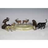 A group of mainly early 20th century cast metal model animals, including a cast bronze model of a